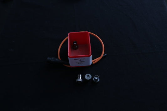 red box with SMA Male to BNC female adapters
