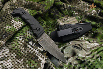 Fixed blade knife on camo background