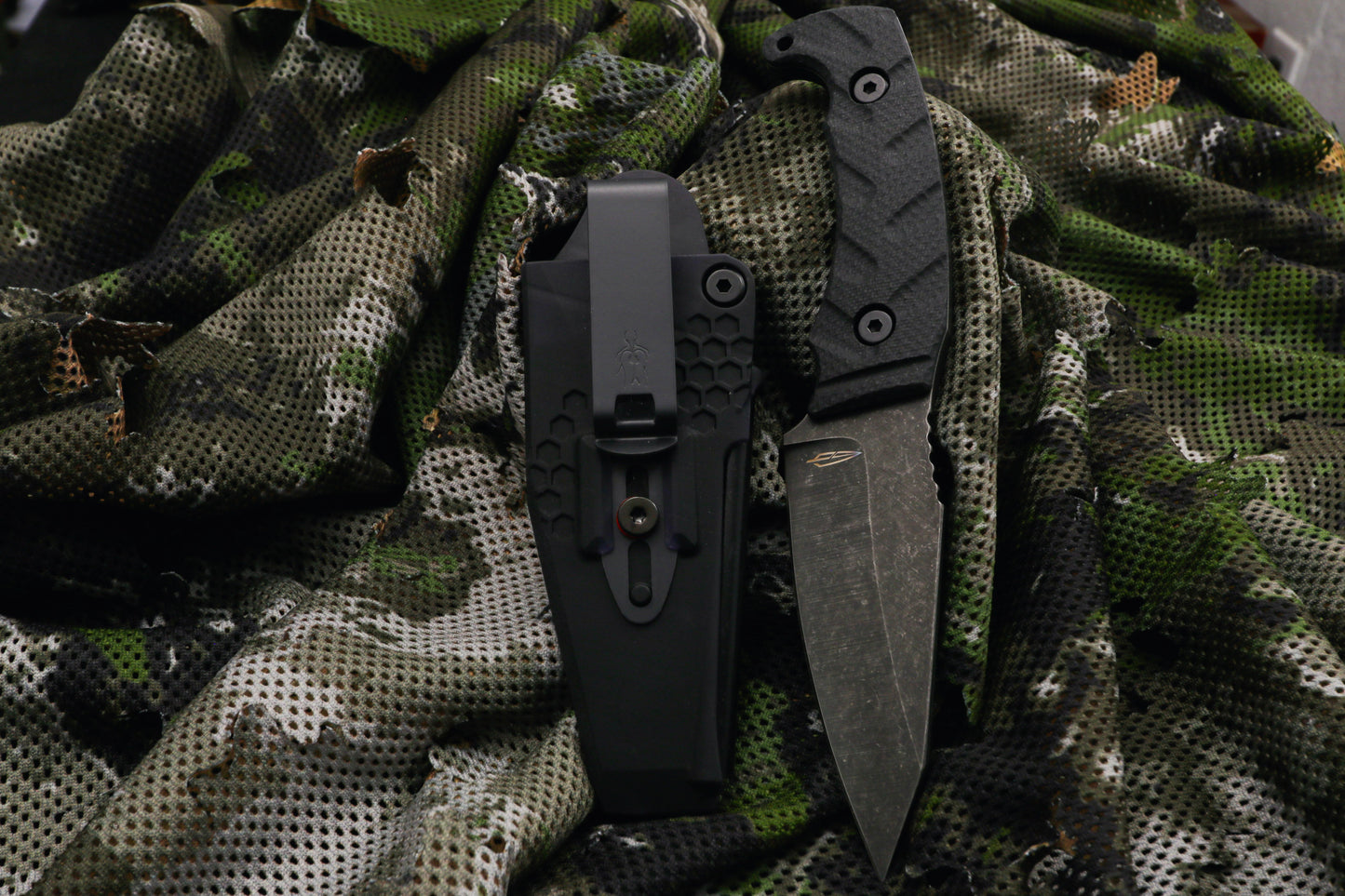 fixed blade knife on camo background