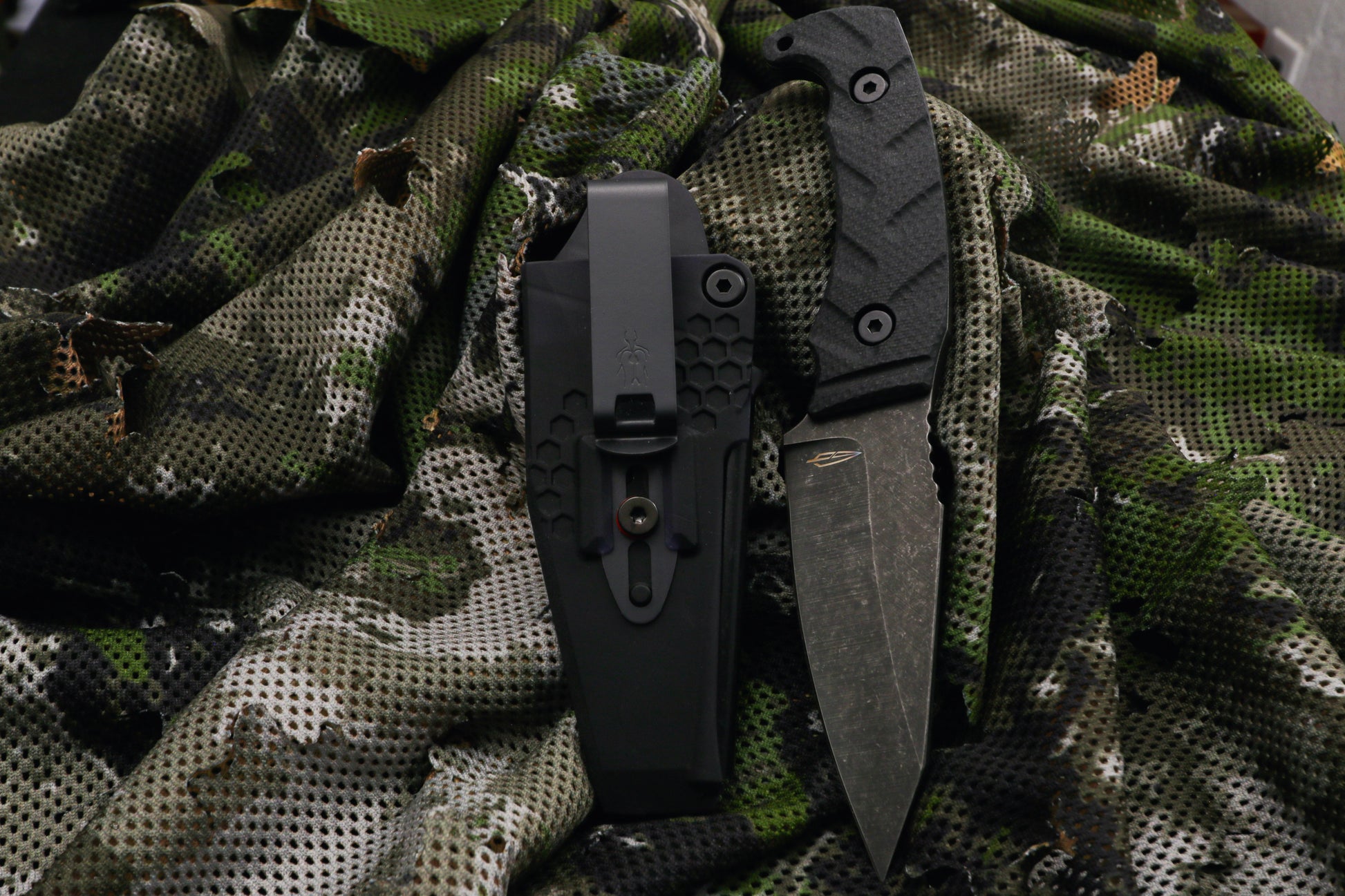 fixed blade knife on camo background
