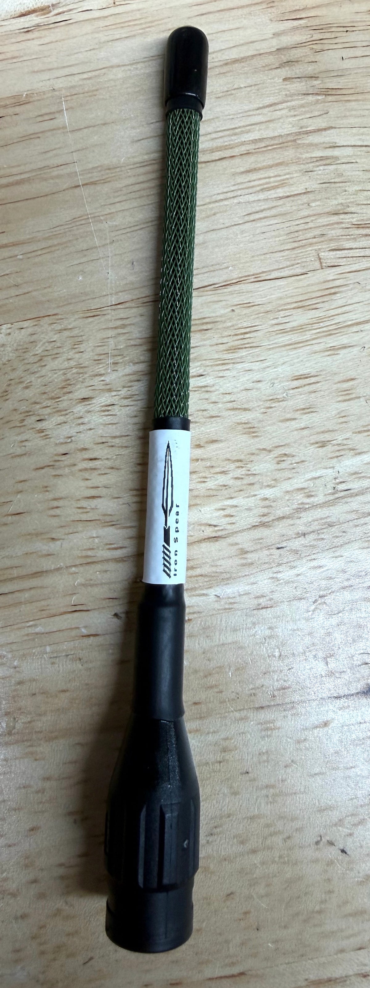 Minimus antenna OD Green on wood.